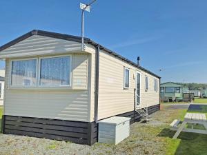 a tiny house sitting on top of a yard at Waterlily in Lancaster