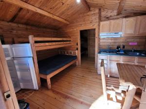 a kitchen with a bunk bed in a cabin at Baraboo RV Resort in Baraboo