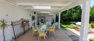 a patio with a table and chairs and a fence at Domus DEA Holiday Home in Pompei +83 photos