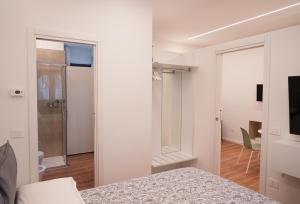 a bedroom with a bed and a sliding glass door at Hortus slow room in Montesarchio
