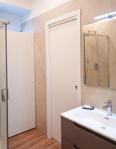 a bathroom with a sink and a mirror at Hortus slow room in Montesarchio +13 photos