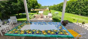 a pool of fruit sitting on top of a table at Domus DEA Holiday Home in Pompei