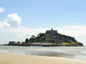 a castle on top of an island in the ocean at Chy-Vean in Madron