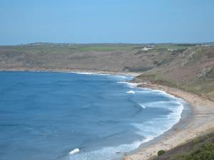 an aerial view of a beach with people in the water at Chy-Vean in Madron +12 photos