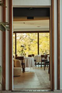 a dining room with a table and some chairs at Hotel delle Rose a Luxury Boutique Hotel in Porto Cervo