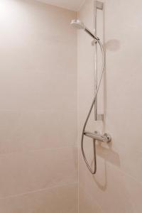 a shower with a shower head in a bathroom at Frankenfelsberg in Oedrotte +12 photos