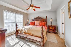 a bedroom with a bed and a ceiling fan at Birmingham Haven New Deck King Bed No Cleaning Fee in Birmingham