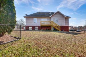 a large house with a porch and a deck at Birmingham Haven New Deck King Bed No Cleaning Fee in Birmingham