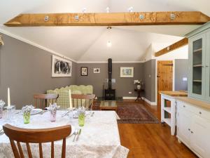 a dining room with a table and chairs at The Old Dairy in Warminster