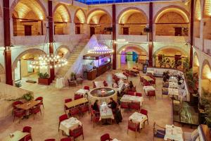 an overhead view of a restaurant with tables and chairs at Silk Road Museum Hotel in Tokat