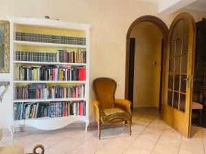 a room with two book shelves filled with books at Villa Ennio in Ciampino