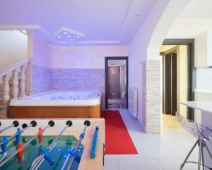 a large bathroom with a tub and a pool table at Villa Ennio in Ciampino +34 photos