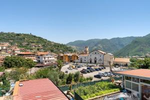 a city with cars parked in a parking lot at La Casa Di Zio Michelino in Pimonte