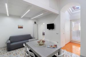 a living room with a table and a couch at La Casa Di Zio Michelino in Pimonte
