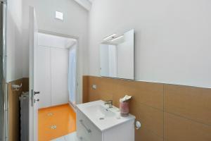 a bathroom with a sink and a mirror at La Casa Di Zio Michelino in Pimonte +13 photos