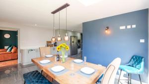 a dining room with a wooden table and chairs at Firsbrook House - Wark Northumberland in Wark