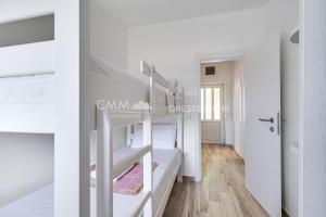 a bedroom with two bunk beds in a room at Villa Masha in Rijeka Reževići