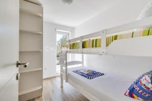 a bedroom with two bunk beds and a ladder at Villa Masha in Rijeka Reževići +15 photos