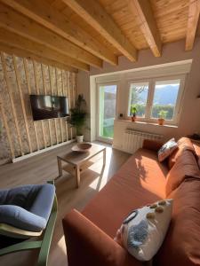 a living room with a couch and a tv at Verde & Mar in Castro-Urdiales