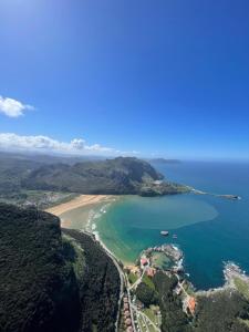 an aerial view of a beach and the ocean at Verde & Mar in Castro-Urdiales