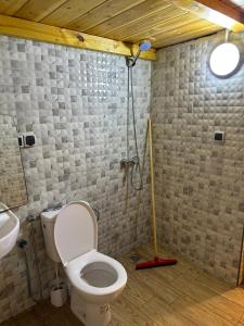 a bathroom with a toilet and a sink at Blue Drift in Imsouane +33 photos