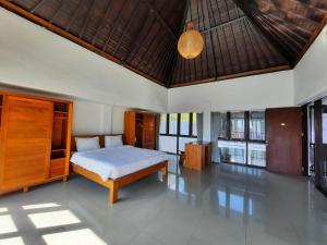 a bedroom with a bed in a room at Serenity Nirvana Palace Jimbaran - Near Uluwatu in Jimbaran