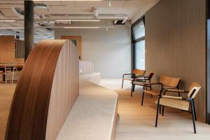 a room with chairs and a table in a building at Geneva Youth Hostel in Geneva