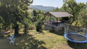 a gazebo with a gazebo with a gazeb at Lilac Orbeti - Cool Climate Country House Near Tbilisi in Pantiani