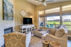 a living room with a fireplace and a tv at Home w/ Golf Course, Mountain Views & EV Charging! in Peyton