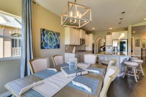a dining room and kitchen with a table and chairs at Home w/ Golf Course, Mountain Views & EV Charging! in Peyton
