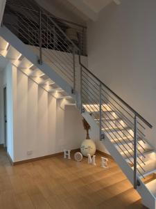 a staircase in a house with a vase in a room at Villa Forni in Cesenatico
