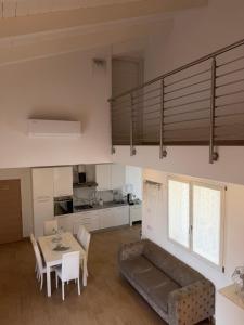 a living room with a couch and a table at Villa Forni in Cesenatico