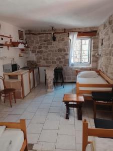 a large room with a kitchen and a table at Slavko in Hvar