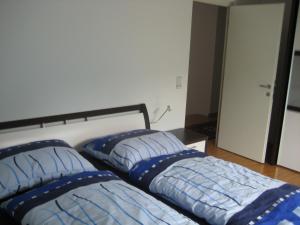 two beds sitting next to each other in a bedroom at Ferienhaus Stemer Montafon in Schruns