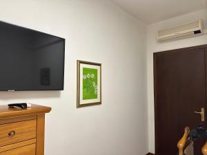 a room with a flat screen tv on a wall at La madonnuccia in Deruta