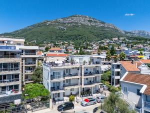 an aerial view of a city with a mountain in the background at Apartments Sarić in Bar