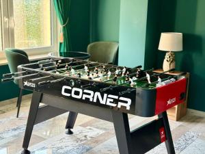 a foosball table with the word corner on it at Perła Chmielna in Chmielno