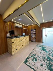 a lobby with a reception desk and a rug at Royal Night Pyramids View Inn in Cairo