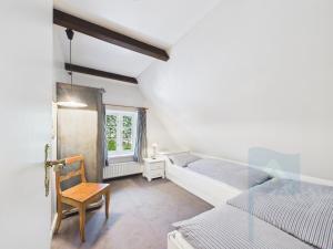 Rúm í herbergi á Ferienwohnung die Scheune