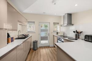 a kitchen with white cabinets and a counter top at 114 North Street in St. Andrews