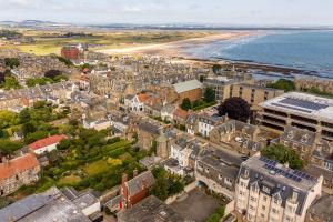an aerial view of a city and the beach at 114 North Street in St. Andrews +13 photos