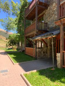 a building with a balcony on the side of it at ABELLETES - K31 DeuSol - Vall d'Incles - Soldeu Hut 6057 in Incles