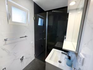 a bathroom with a shower and a sink at Aster Apartments in Belgrade +31 photos