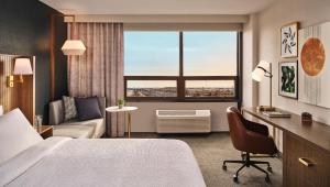 a hotel room with a bed and a window at Holiday Inn & Suites Tijuana Downtown by IHG in Tijuana