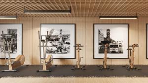 a gym with four pictures on the wall with exercise bikes at Holiday Inn & Suites Tijuana Downtown by IHG in Tijuana