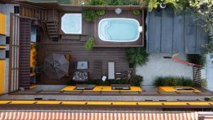 an overhead view of a house with an umbrella at Pousada Maria Eduarda in Guarda do Embaú +7 photos
