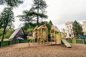 a playground with a slide and a play structure at Drimsynie Estate Hotel in Lochgoilhead