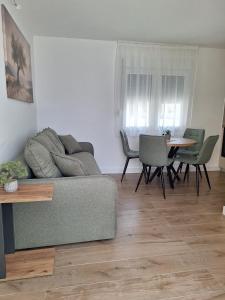 a living room with a couch and a table at Savo Apartments in Tivat