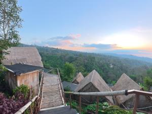 a view of a village with thatched roofs at Wanagiri sunset glamping in Gitgit