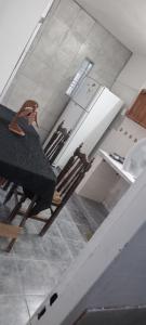 a chair in a room with a ceiling at Yuntasuma II in San Fernando del Valle de Catamarca